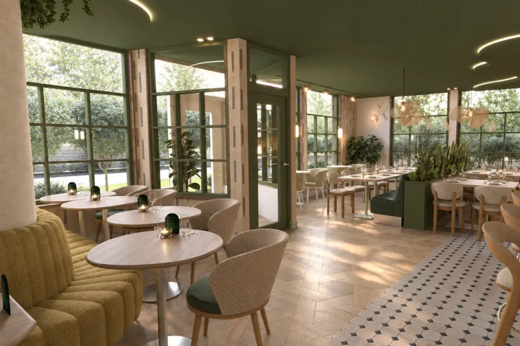 Ruim en sfeervol restaurantinterieur met ronde tafels, comfortabele stoelen, een groene zitbank, veel planten en grote ramen. Het interieur combineert warme houttinten, groen en natuursteen met sfeervolle verlichting
